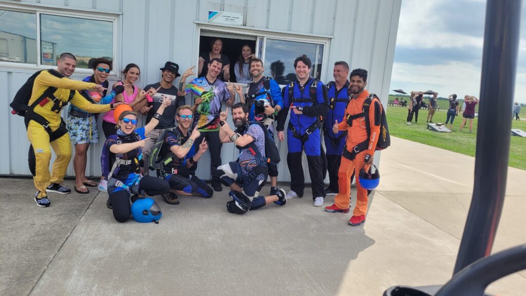 The skydiving community gathers to celebrate a solo skydiving student earning their license at Skydive Chicago.