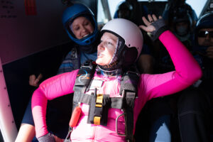 a solo skydiver training in the Skydive Chicago AFP program rehearsing their dive in the plane