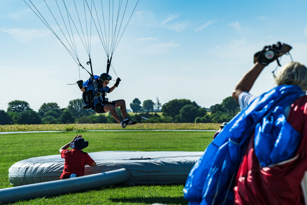 An accuracy skydiving competitor trying to land dead center on a target during Nationals at Skydive Chicago.