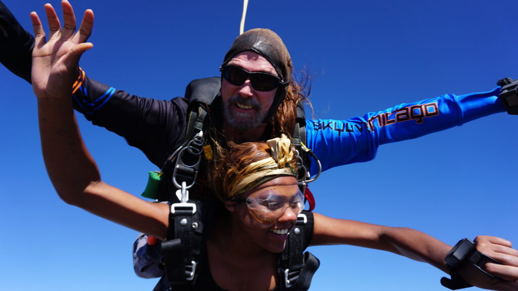 A tandem pair above Skydive Chicago