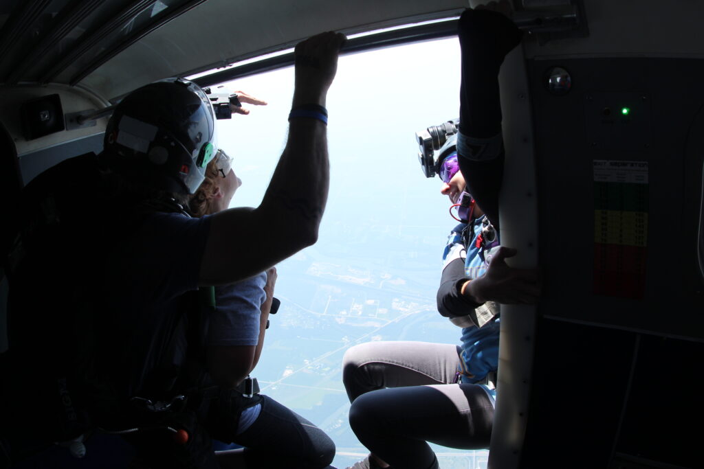 Skydiving photographers capturing a tandem skydive at Skydive Chicago