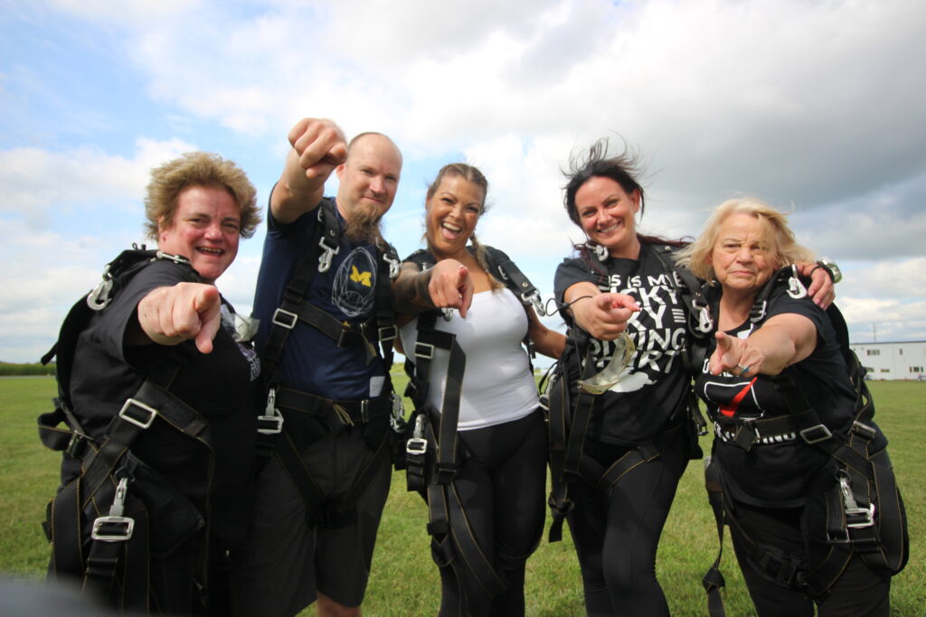 tandem skydiving students looking at YOU to go skydiving!