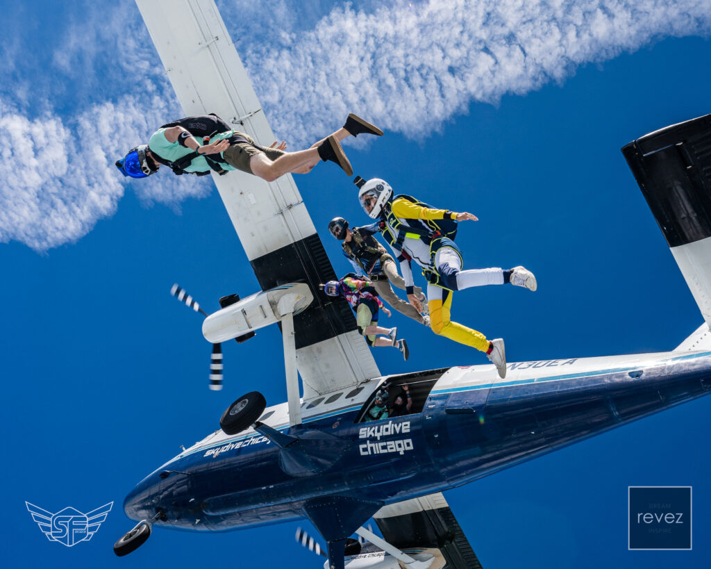 When you earn a license, you can learn to angle fly - a popular discipline of skydiving. This is an angle group exiting at 13,500' over Skydive Chicago.