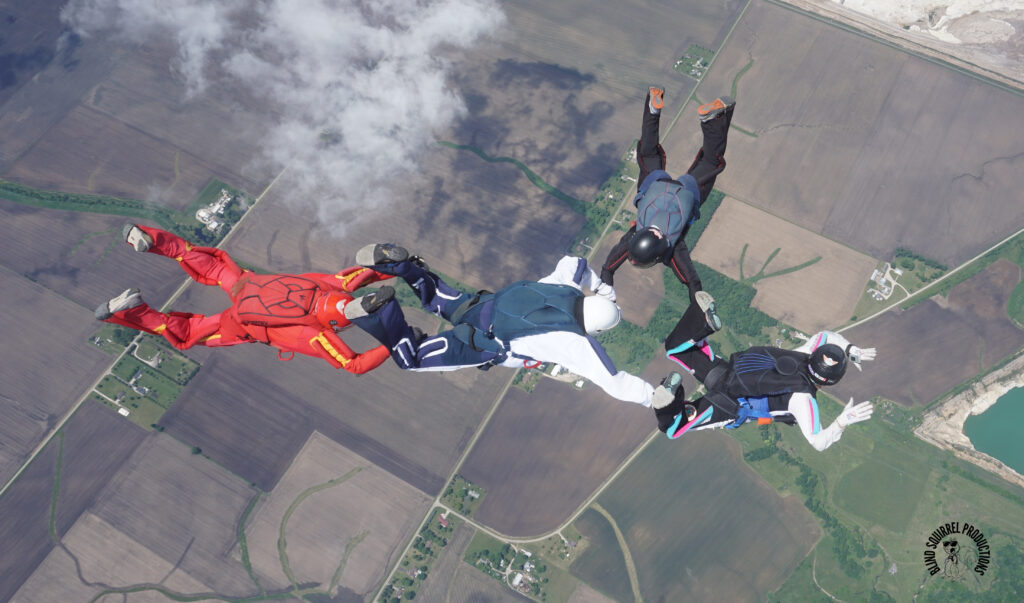 A and B-licensed skydivers doing a 4-Way dive at Skydive Chicago