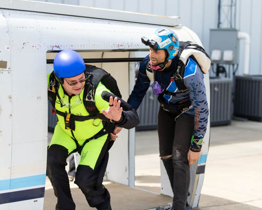 An AFP instructor rehearsing the dive from a mockup at Skydive Chicago