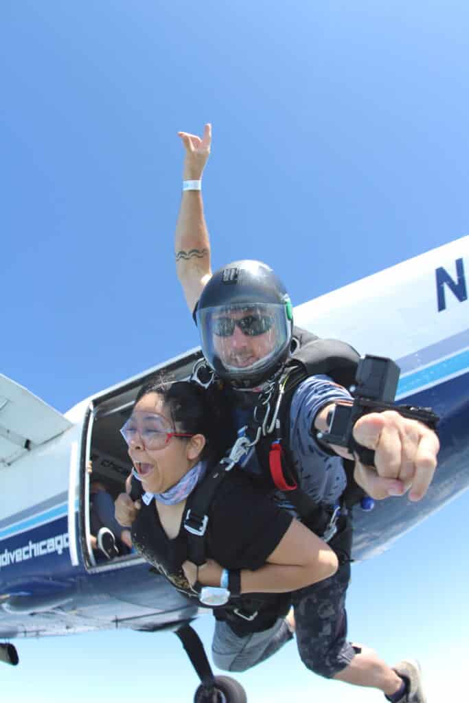 a first time tandem student on exit, wearing their hair in a pony tail