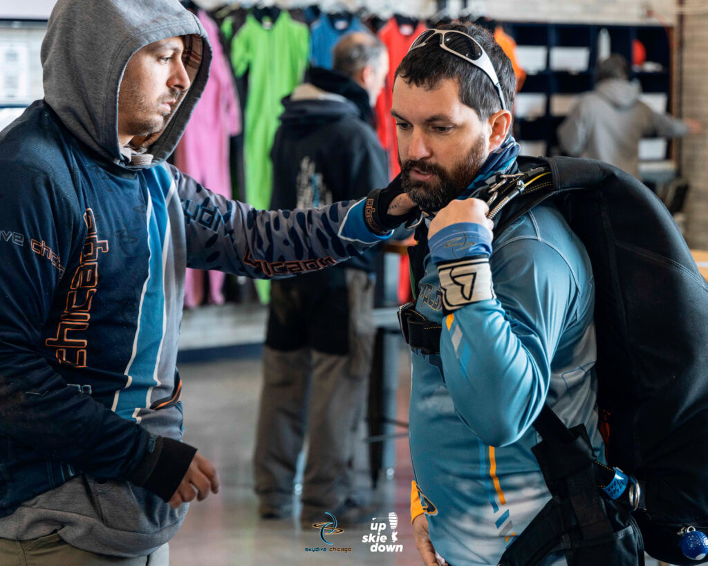 Baxter preparing for a tandem skydive as instructor at Skydive Chicago