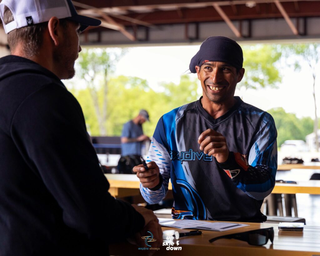 Skydiving instructor Ryan Reb debriefing a student