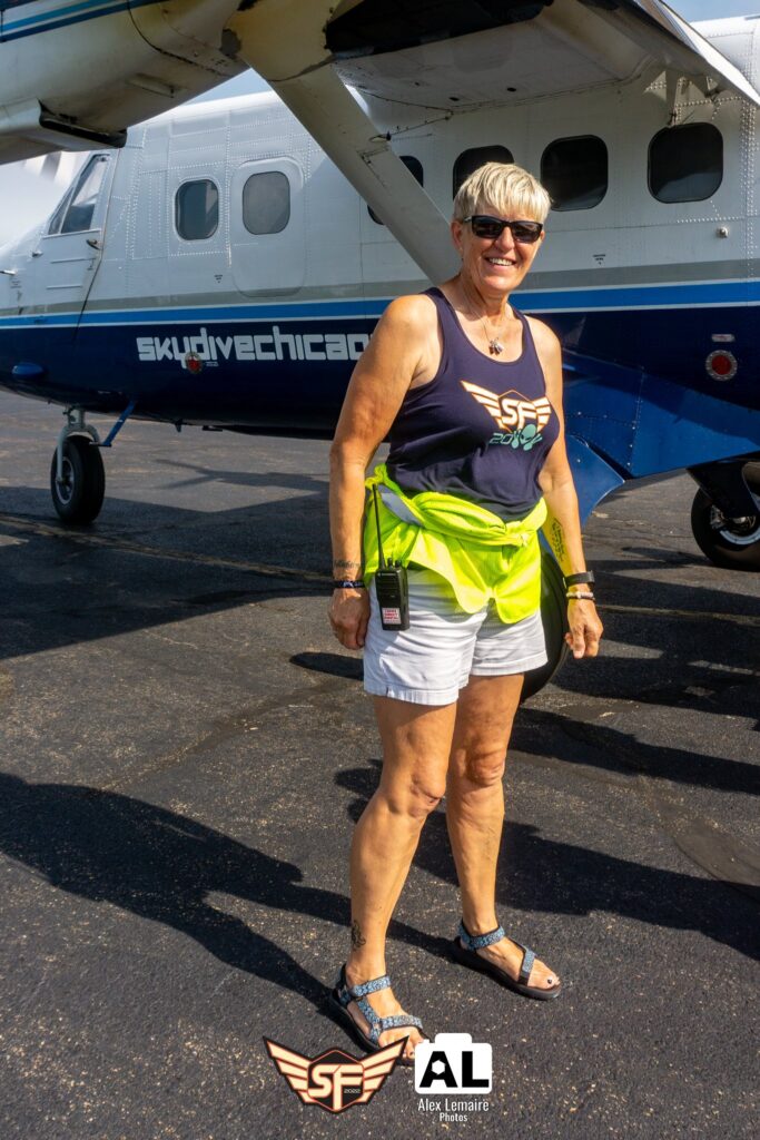 Christa Cross posing as she loads skydive planes at Skydive Chicago