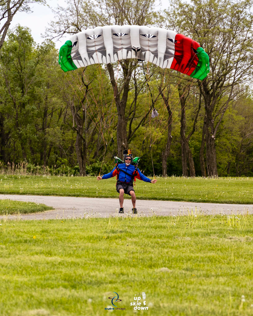 Charles Lane, skydiver and mechanic, lands his parachute