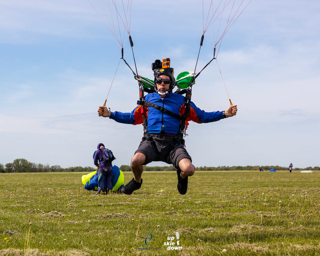 Skydiver, Charles Lane lands his parachute wearing his camera equipment at Skydive Chicago