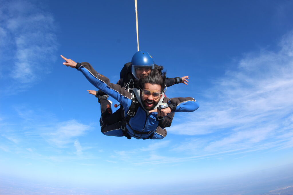 Instructor Ryan Reb in freefall with a student at Skydive Chicago