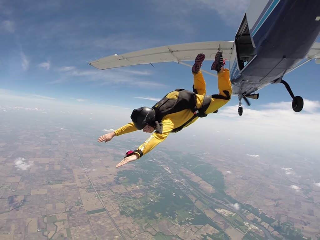 An Advanced Freefall Program [AFP] solo skydiving student exits the plane at Skydive Chicago