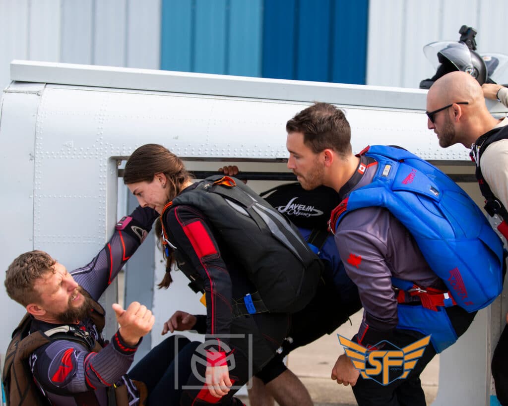 A SDC Summerfest Load Organizer mocks up a jump at Skydive Chicago