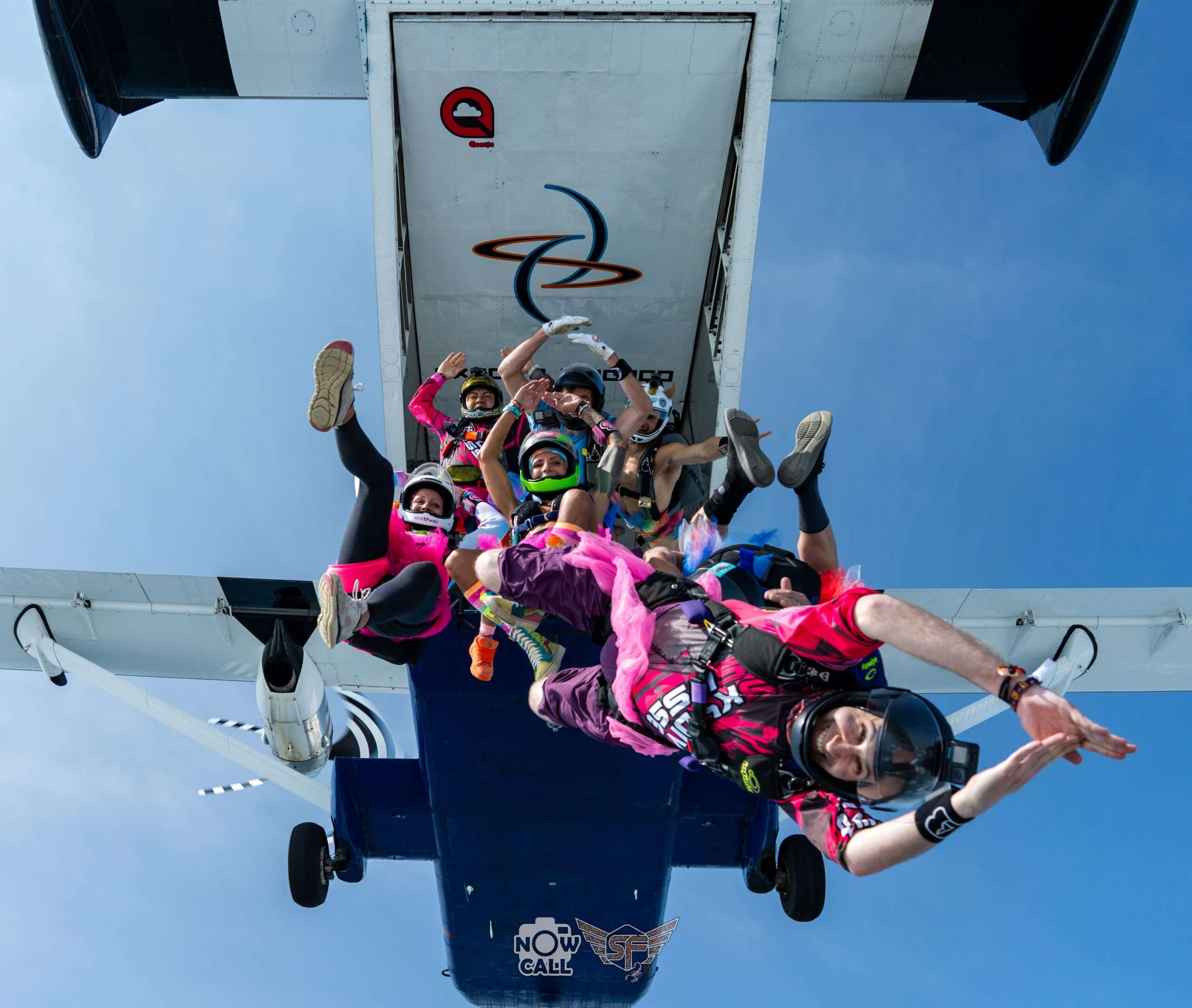 Skydivers exiting from a skyvan in costumes at SDC Summerfest - photo by Now Call Photography